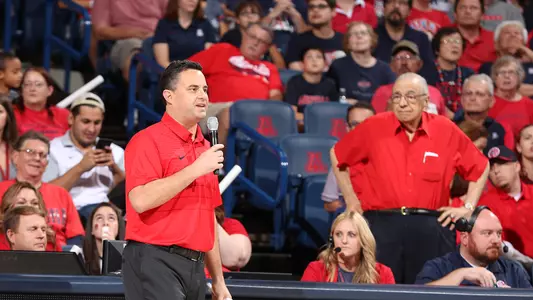 George Kalil stands behind head coach Sean Miller during the 2017 Red-Blue Game