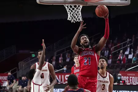 Arizona forward Jordan Brown (21) scores over Southern California forward Isaiah Mobley (3) during the first half of an NCAA college basketball game Saturday, Feb. 20, 2021, in Los Angeles. (AP Photo/Marcio Jose Sanchez)