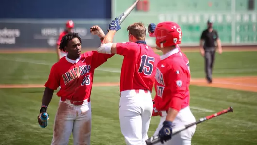 Donta' William and Branden Boissiere celebrate Jacob Berry's home run