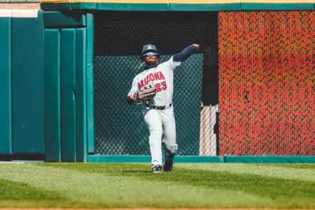 Donta' Williams makes a throw from center field