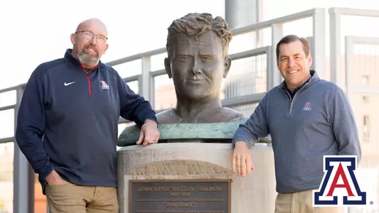 Dave heeke next to John Byrd Salmon Statue