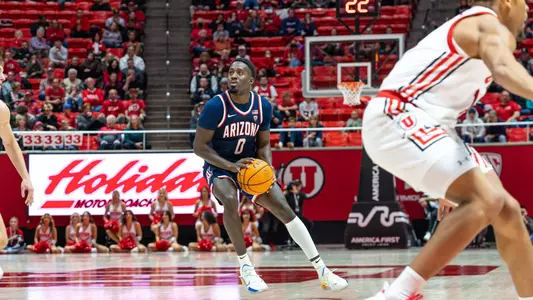 Courtney Ramey gathers before shooting at Utah