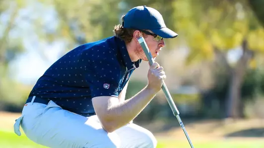 Christian Banke reads a putt on a green during a practice round