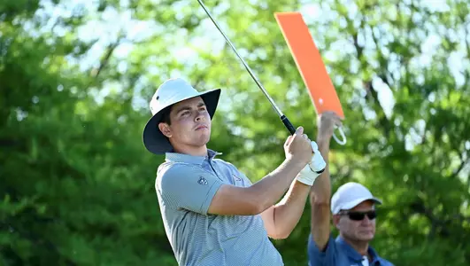 Chaz Aurilia watches his tee shot during the first round of the NCAA Championships