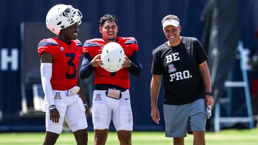Jordan McCloud, Jayden de Laura, and head coach Jedd Fisch