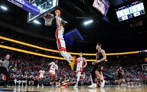 Pelle Larson dunks against Stanford in the quarterfinals of 2023 Pac-12 Tournament.