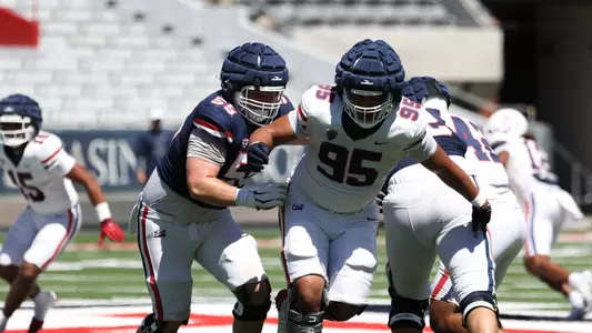 offensive lineman JT Hand (55), defensive lineman Keanu Mailoto (95) - TUCSON, ARIZ. -- Football Scrimmage #1 at the Arizona Stadium
Aug. 12, 2023.
Photo by Catherine Regan / Arizona Athletics