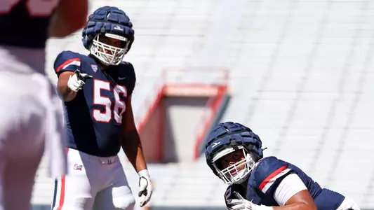 defensive lineman Bryce Echols (56), offensive lineman Jonah Savaiinaea (71) - TUCSON, ARIZ. -- Football Scrimmage #1 at the Arizona Stadium
Aug. 12, 2023.
Photo by Catherine Regan / Arizona Athletics