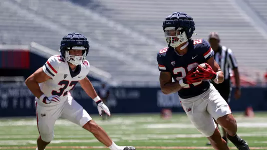 defensive end Nolan Clement (37), running back Stevie Rocker, Jr. (23) - TUCSON, ARIZ. -- Football Scrimmage #1 at the Arizona Stadium
Aug. 12, 2023.
Photo by Catherine Regan / Arizona Athletics
