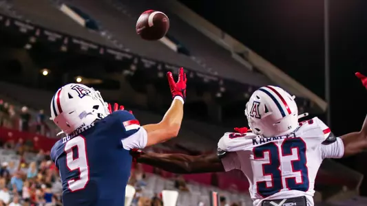 wide receiver Jackson Holman (9), defensive back Emmanuel Karnley (33) - TUCSON, ARIZ. -- Football mock game practice at Arizona Stadium.
Aug. 19, 2023.
Photo by Rebecca Sasnett / Arizona Athletics