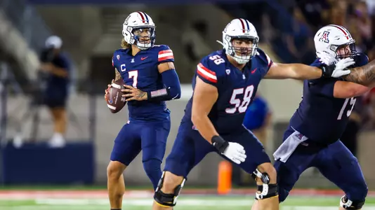 quarterback Jayden de Laura (7), offensive lineman Sam Langi (58) - TUCSON, ARIZ. -- Football vs. Northern Arizona University at Arizona Stadium.
Sept. 2, 2023.
Photo by Mike Christy / Arizona Athletics