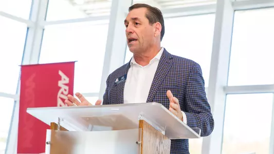 Dave Heeke speaks at a luncheon in the Jim Click Hall of Champions