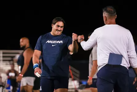 Tyler Michelini, Lucais MacKay, throws coach - TUCSON, ARIZ. -- Track & Field throwers compete in the 2024 Tucson Throws Elite Classic at Roy P. Drachman Stadium.
May 2, 2024.
Photo by Mike Christy / Arizona Athletics