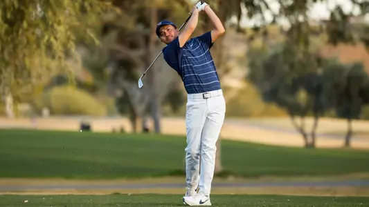Johnny Walker stares down an iron shot from the fairway of Omni Tucson National during 2024 Arizona NIT
