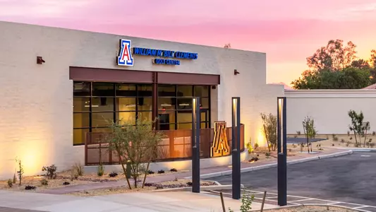 The exterior of the William M. "Bill" Clements Golf Center lit up on its grand opening at Tucson Country Club.