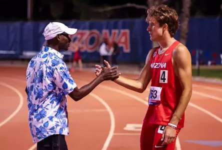 Cade Russo, Bernard Lagat, distance and cross country head coach - TUCSON, ARIZ. -- Track and Field competes in the Jim Click Shootout at Roy P. Drachman Stadium.
April 8, 2023.
Photo by Mike Christy / Arizona Athletics
