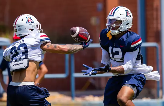 defensive back Gavin Hunter (23), wide receiver Tre Spivey III (12) — TUCSON, ARIZ. -- Football fall camp, day 5.
Aug. 10, 2026.
Photo by Mike Christy / Arizona Athletics