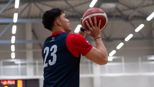 JJ Mandaquit prepares to take a shot during practics in Lithuania