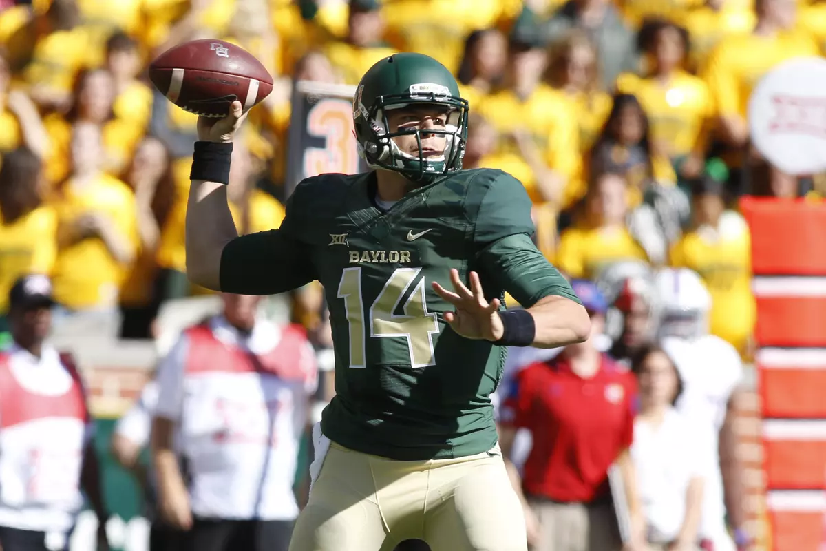 Bryce Petty throws a pass in the first quarter against Kansas.