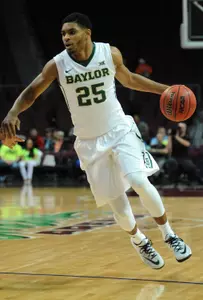 Al Freeman dribbles the ball.