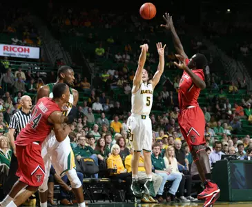 Brady Heslip (5) nputs up a three-point shot