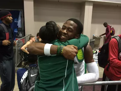 Felix Obi embraces jumps coach Stacey Smith.