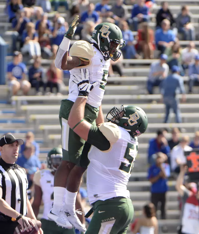 Running back Johnny Jefferson (5) celebrates with offensive tackle Spencer Drango (58) after scoring a touchdown