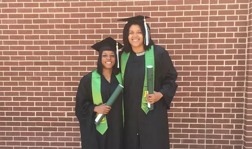 Niya Johnson and Kristina Higgins graduated on Saturday, feat accomplished in three years.