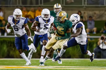 Oct 21, 2017; Waco, TX, USA; Baylor Bears wide receiver Denzel Mims (15) looks for yards after the catch on the West Virginia Mountaineers defense at McLane Stadium. Mandatory Credit: Ray Carlin-USA TODAY Sport