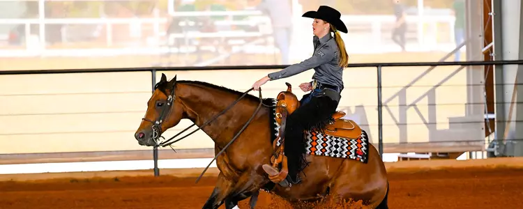 Madaline Callaway competes in a Reining ride at Oklahoma State in 2022