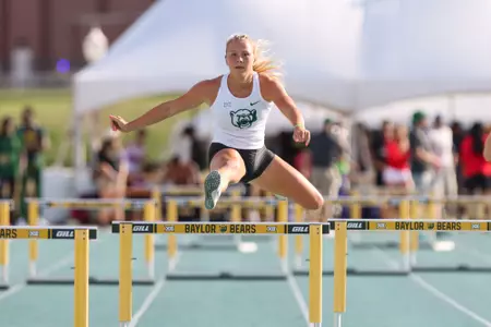 Audrey Williamson hurdling at the MJ Invite