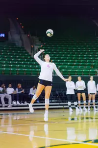 Sophia Keene serves up the ball during the first set.