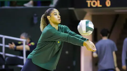 Alexis Dacosta bumps the ball during warmups.