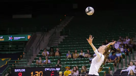 Mallory Talbert serves the ball during the second set.
