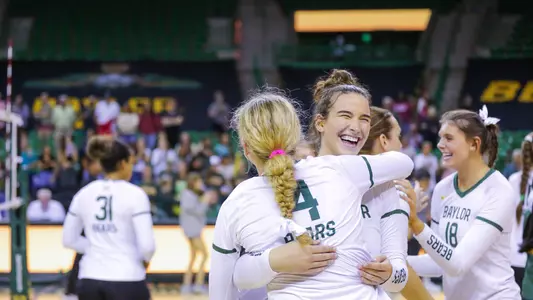 Elise McGhee and Allie Sczech embrace after the Bears win.