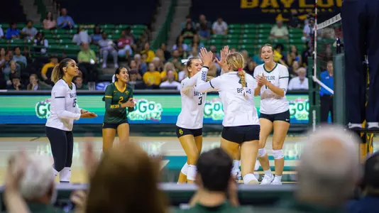 The Bears celebrate a point in the third set.
