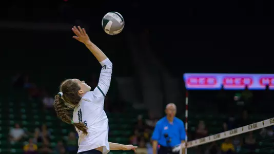 Mallory Talbert goes for an attack in the fourth set.