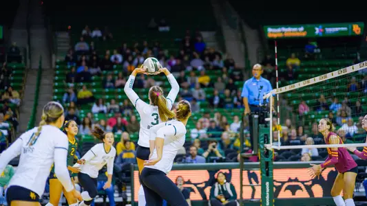 Averi Carlson sets the ball against Iowa State