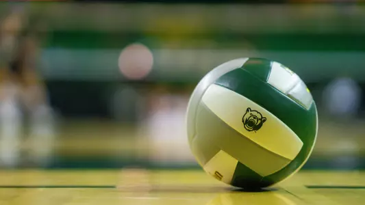 A Bear Head branded volleyball rests on the court prior to the match against Evansville.