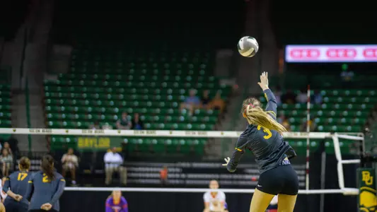 Averi Carlson serves the ball against Evansville.