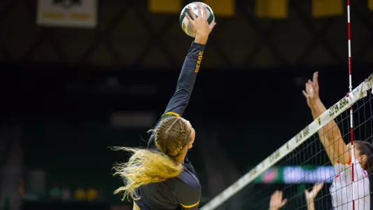 Allie Sczech goes up for an attack against Evansville.