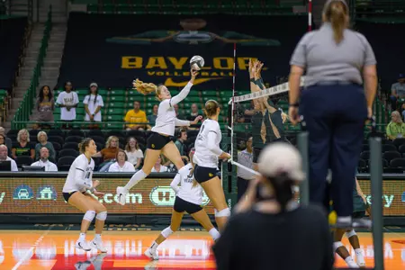 Riley Simpson tips the ball against Colorado State.