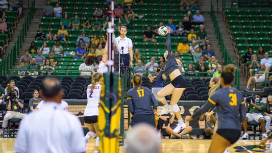 Allie Sczech goes up for an attack against Evansville.