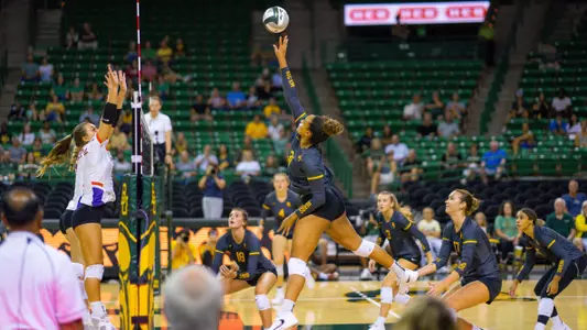 Lauren Harrison goes for a kill against Evansville.