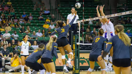 Lauren Harrison tips the ball against Evansville.