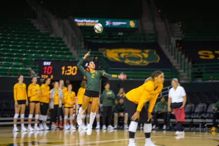 Lauren Briseño serves the ball against ASU.