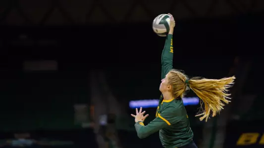 Riley Simpson spikes the ball against McNeese.