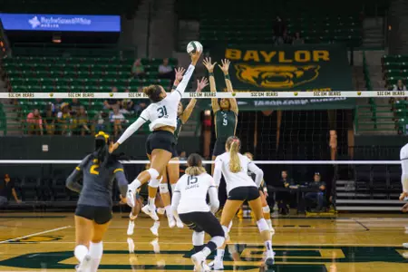 Lauren Harrison tips the ball against Colorado State.