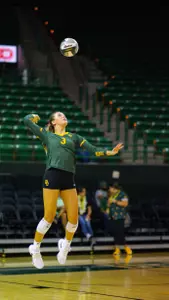 Averi Carlson serves the ball against McNeese.