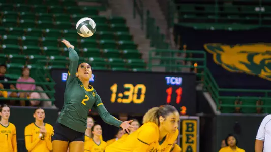 Lauren Briseño serves the ball against the Horned Frogs.